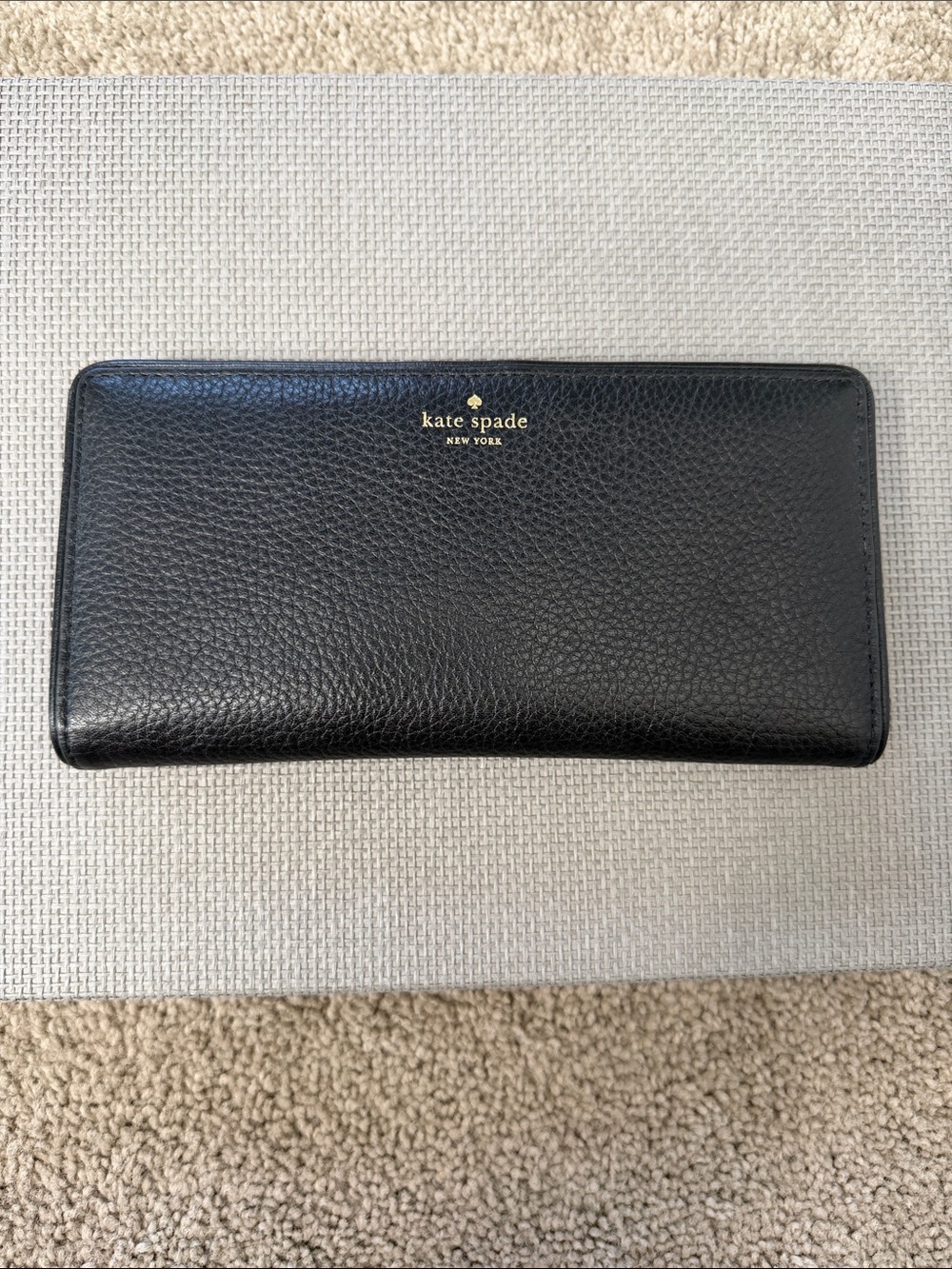 kate spade black pebbled leather wallet with gold logo